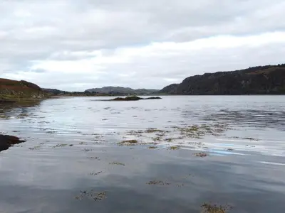 a large body of water with mountains in the background at Scarba in Oban