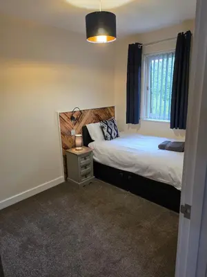 a bedroom with a bed and a window at Balnakeil house