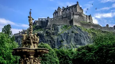 a statue in front of a castle on a mountain at Edinburgh Central Lauriston Large Apartment in Edinburgh