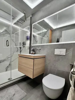 a bathroom with a toilet and a sink and a shower at Central London Designer Room with Balcony Elevator in Moffat