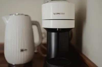 a coffee maker and a blender on a table at Charming Central Mews Home with Secure Parking in Edinburgh