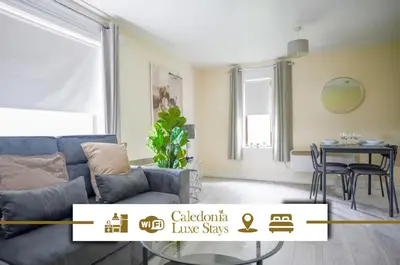 a living room with a couch and a table at Arranview Retreat in Airdrie