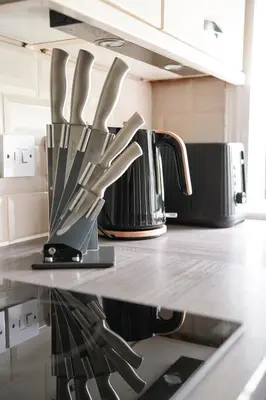 a group of knives on a counter in a kitchen at Arranview Retreat in Airdrie