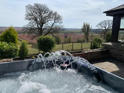 a fountain in a garden with water coming out of it at The Cottage in Perth