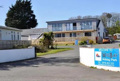 a house with a wesley hay sign in front of it at Loch View 28 in Stranraer