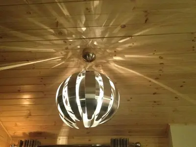 a light fixture hanging from a ceiling in a room at Sòghail Luxury Lodge and Balquhidder Mhor with Hot Tub in Kingshouse
