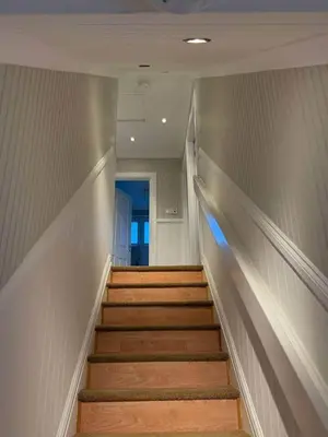 a long hallway with stairs in a building at Modern 2BR Sleeps 4 Central Scotland with Parking in Banknock
