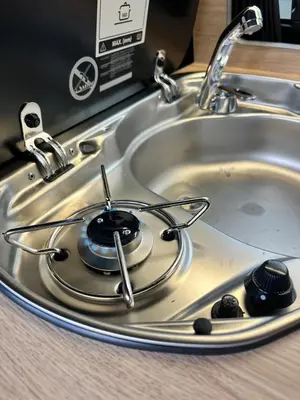 a sink with a frying pan in the middle at Campervan Scotland, Ben Roamer in Dunblane