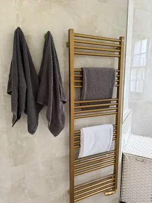 a towel rack in a bathroom with towels at Happy two bedrooms apartment in Moffat