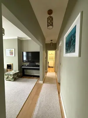 a living room with a television and a piano at Happy two bedrooms apartment in Moffat