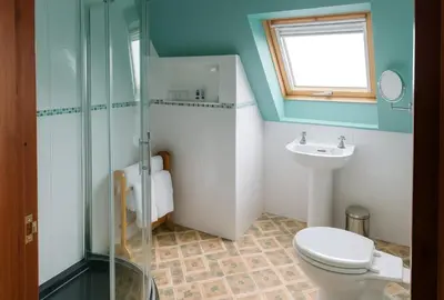 a bathroom with a toilet and a sink at Ocean View Lodge in Kilchiaran