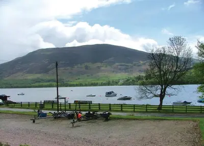 a view of a lake with boats in the water at Lochearnhead Loch Side in Lochearnhead