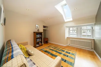 a living room with a couch and a window at The Granary in Dunira