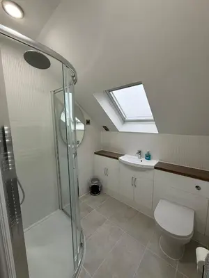 a bathroom with a shower and a toilet and a sink at Luxury townhouse in Stirling in Stirling
