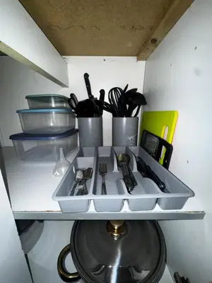 a kitchen sink with utensils on a shelf at 4BR Home near Airport & City Centre Free Parking in Edinburgh