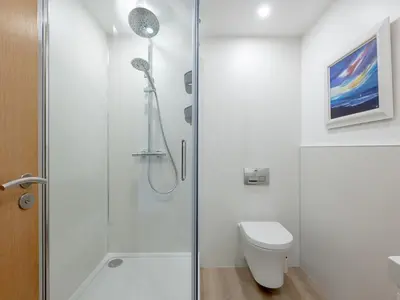 a bathroom with a shower and a toilet at Pass the Keys Spacious Bright Modern Edinburgh City Flat in Edinburgh