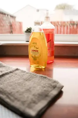 a bottle of mustard sitting on top of a table at 4 BDR House By Caledonia Luxe Stays Short Lets & Serviced Accommodation Livingston in Livingston