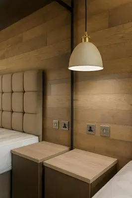 a room with two beds and a light fixture at Luxury Lodge