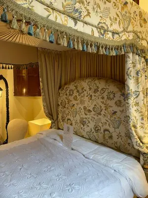 a bedroom with a bed with a canopy at Fordells Lodgings Stylish Rooms in Historic Townhouse in Inverkeithing
