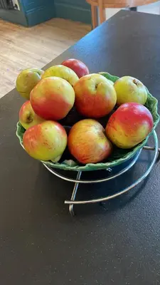 a bowl of fruit sitting on a table at Fordells Lodgings Stylish Rooms in Historic Townhouse in Inverkeithing