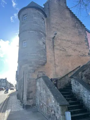 a large building with stairs leading up to it at Fordells Lodgings Stylish Rooms in Historic Townhouse in Inverkeithing