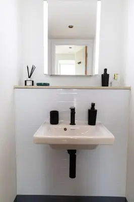 a bathroom with a white sink and a mirror at For Students Only Martha Street Glasgow in Glasgow
