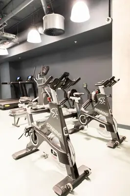a row of exercise bikes in a gym at For Students Only Martha Street Glasgow in Glasgow