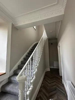 a staircase with white railings in a house at Victorian 5 Bedroom House Free Parking SSE Central in Glasgow
