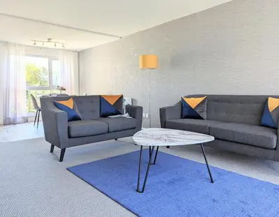 a living room with two couches and a coffee table at Fairway house in Campbeltown