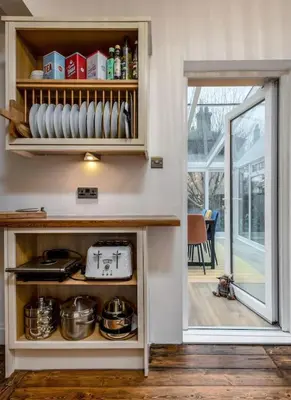 a kitchen with a counter with pots and pans at Tranquil Glasgow Retreat in Glasgow