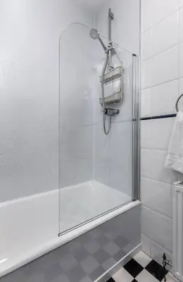 a shower with a glass door in a bathroom at Tranquil Glasgow Retreat in Glasgow
