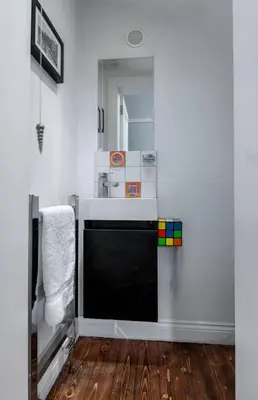 a bathroom with a sink and a mirror at Tranquil Glasgow Retreat in Glasgow