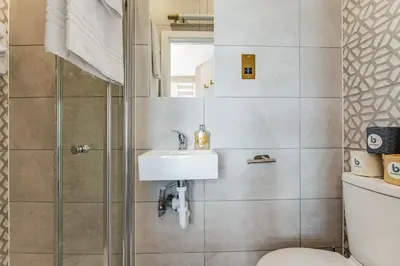 a bathroom with a sink and a shower at Stylish Studio Retreat in Ideal Location in Moffat