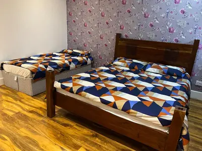 a bedroom with two beds in a room at Perfect Stay Near Glasgow Town in Glasgow