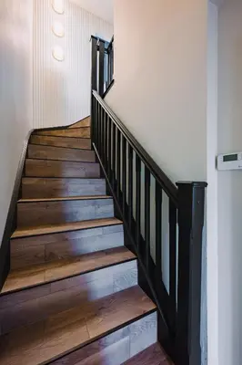 a staircase in a house with wooden floors at JW Executive ApartHouse 2 in Glasgow