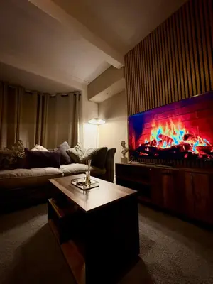 a living room with a large flat screen tv at Cozy corner-Sleeps 8 guest Entire house Glasgow very central in Glasgow