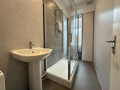 a bathroom with a sink and a shower at Appin Apartments - Welcome to a delightful and cozy one bedroom flat in Glasgow
