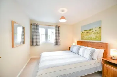 a bedroom with a large bed in a room at Amazing Apartment by The Wallace Monument in Stirling
