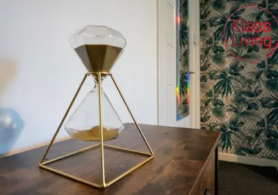 a vase sitting on top of a wooden table at Lady Wilson Apartment by Klass Living Airdrie in Airdrie