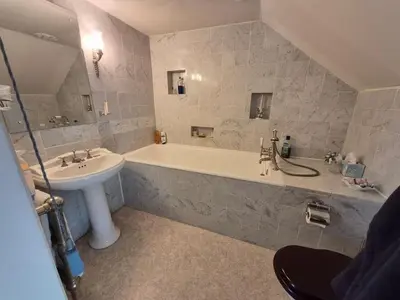 a bathroom with a sink and a bath tub and a sink at Kilfinichen Church in Kilfinchen