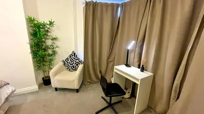 a room with a desk and a chair next to a window at Luxury Spacious Double Room, Mill Hill, London NW7 3BD in Moffat