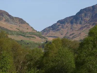 a view of a valley with trees and mountains at The Clachan Hotel, Lochearnhead in Lochearnhead