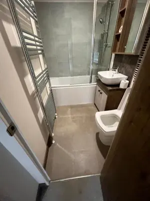 a bathroom with a toilet and a sink at Wemyss Bay Beaumont Elite in Skelmorlie