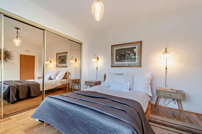 a bedroom with two beds and a mirror at 3 Bed in Kirkcolm oc-b34009 in Kirkcolm