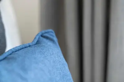 a close up of a persons blue suit and tie at Linden House in Hamilton