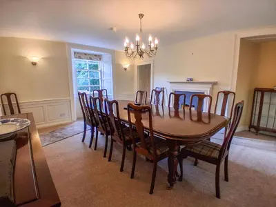a dining room with a table and chairs at Hillside House in Dunfermline