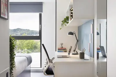a bedroom with a desk with a computer and a window at For Students Only Westfield in Edinburgh in Edinburgh