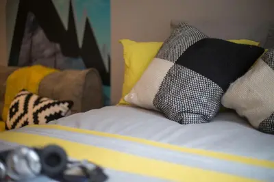 a bed with pillows on top of it at For Students Only - Willowbank in Glasgow in Glasgow