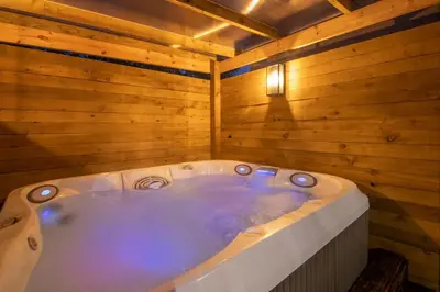 a jacuzzi tub in a wooden room at Private Hot Tub - Zen & Bubbles in Edinburgh
