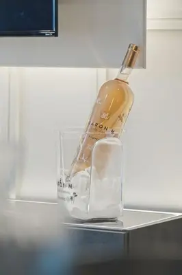 a bottle of wine sitting on top of a counter at 2BR West End Apartment Near Botanic Gardens in Glasgow